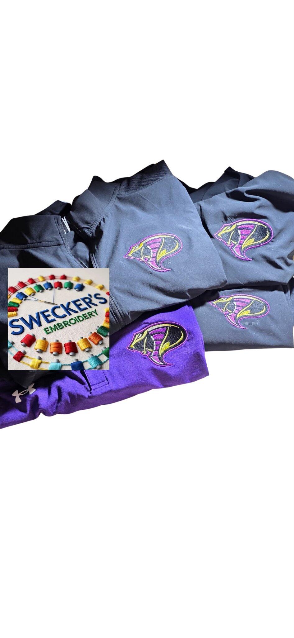 Dark and purple polos with multicolor cobra-style chest embroidery